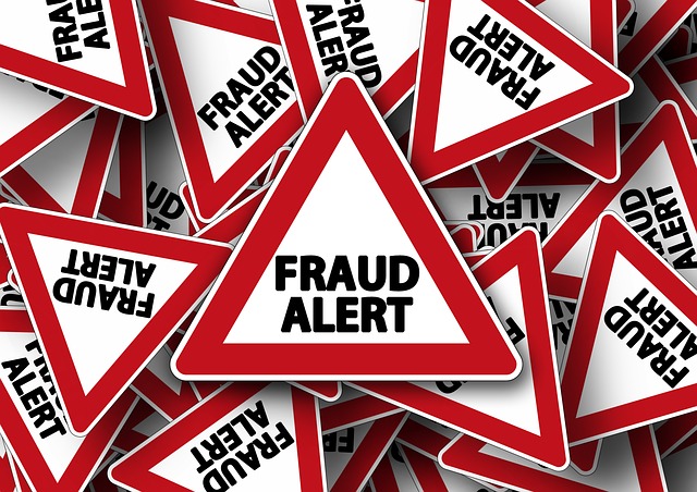 Multiple warning signs reading “FRAUD ALERT”