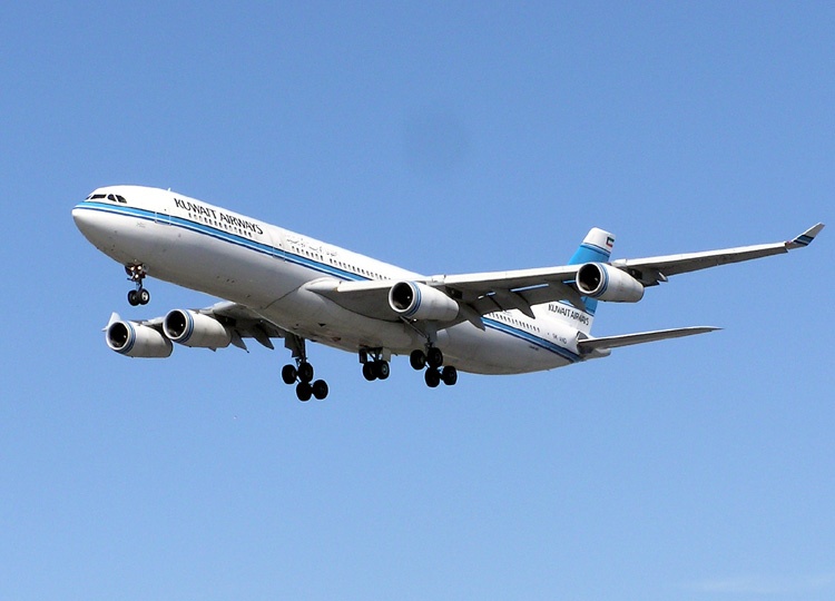 A passenger airplane flying through a blue sky