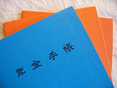 Blue and orange pension books